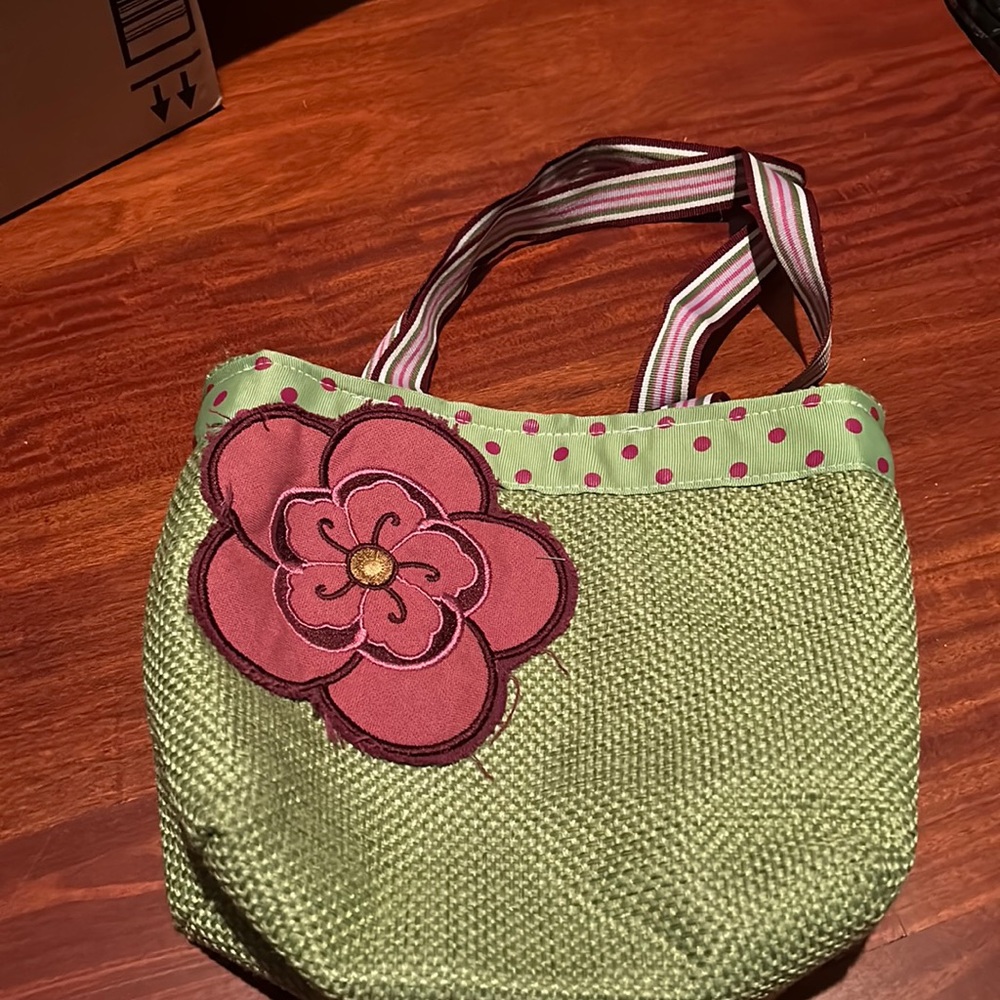 Handmade green bag with ribbon straps